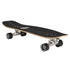 A Carver 30-Year Limited Edition surfskate skateboard with a black grip-tape deck, natural wood edge, silver metal trucks, and black wheels, shown from a three-quarters perspective on a white background.