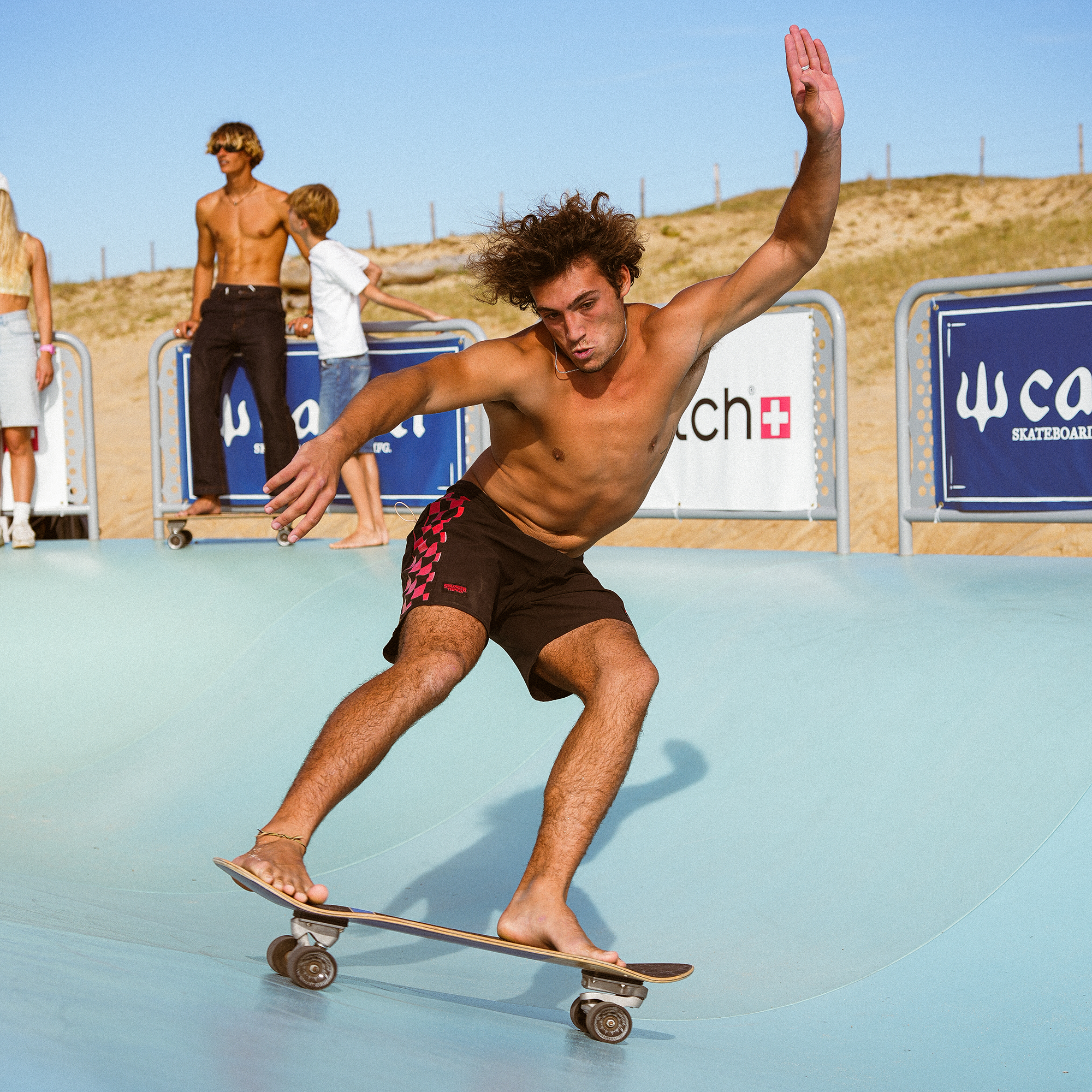 Surfskater carving the Wavebank transition